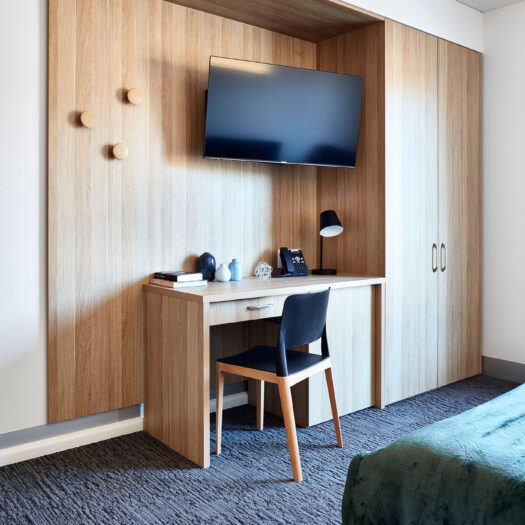 TLC Aged Care Homestead Estate bedroom cabinet, chair and storage - building photographer example / concept