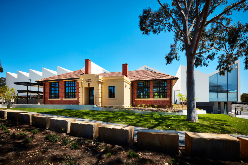 Nunawading Community Hub brick state school facade with sawtooth roofline behind - structure photographer example / concept