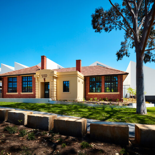 Nunawading Community Hub brick state school facade with sawtooth roofline behind - structure photographer example / concept