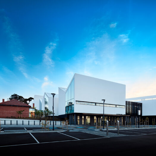 Nunawading Community Hub view across old and new sections of building across carpark - structure photographer example / concept