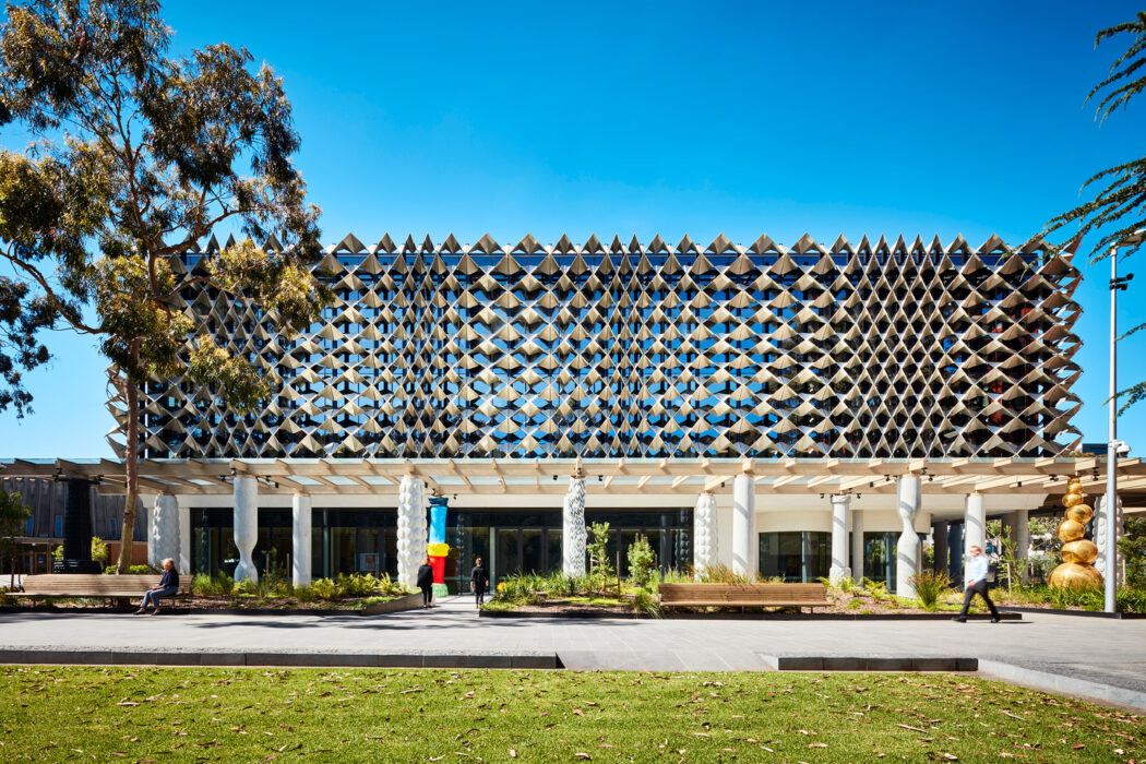 Monash University Chancellery view of building facade with steel mesh and unique artist columns - University example / concept