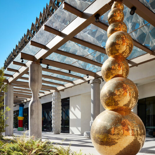 Monash University Chancellery featuring brilliant golden sculpture reflecting sunlight - University example / concept
