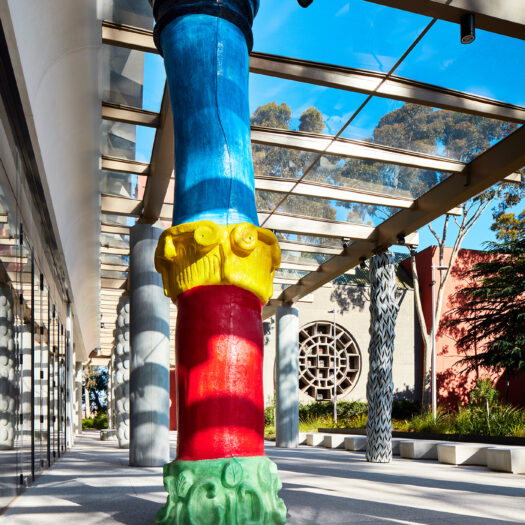 Monash University Chancellery multi coloured artist column with Blackwood Hall in background - University example / concept