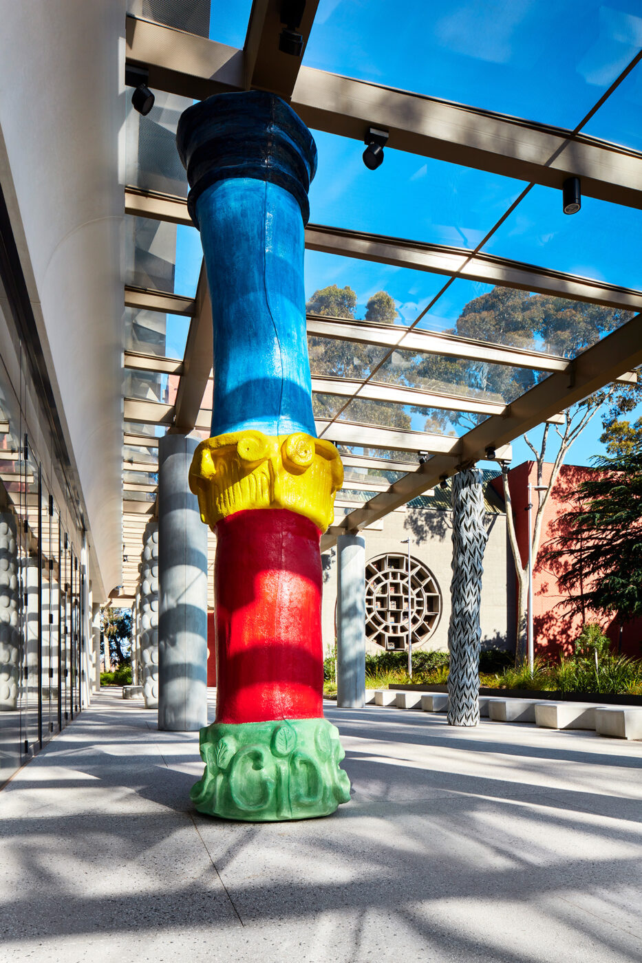 Monash University Chancellery multi coloured artist column with Blackwood Hall in background - University example / concept