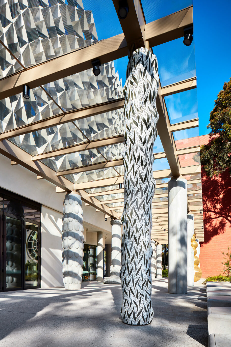 Monash University Chancellery black and white artist column and late afternoon shadow play - University example / concept