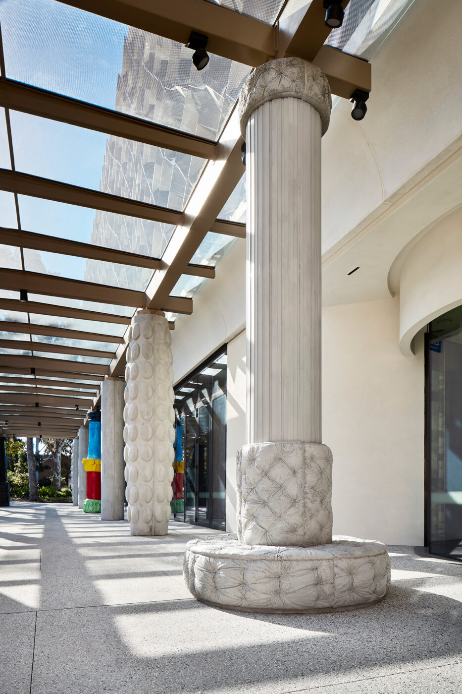 Monash University Chancellery concrete cushion artist column in late afternoon sunlight - University example / concept