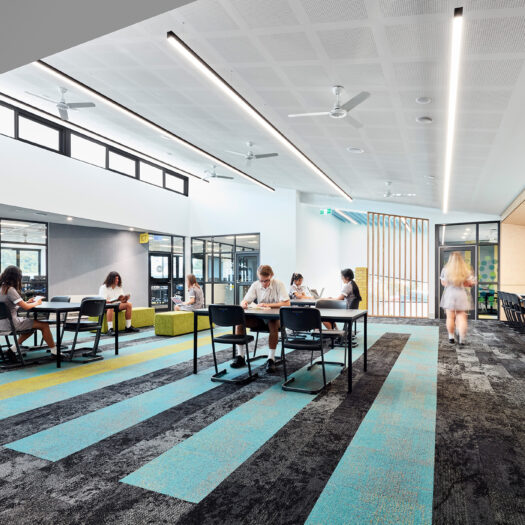 Ringwood Secondary College blue linear carpet, timber bench, highlight window, view into classrooms and open study space - High School photography example / concept