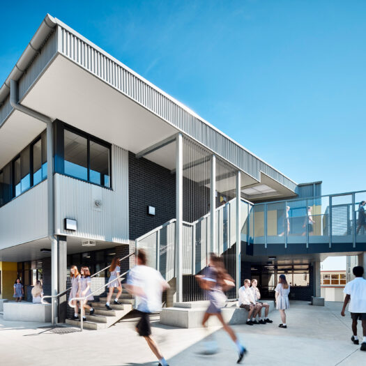Ringwood Secondary College external staircase on senior learning centre with bridge connecting to next building and students circulating - High School photography example / concept